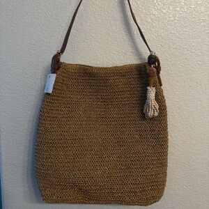 Stylish Handwoven Straw shoulder Bag with vegan leather strap and Tassel Charm.